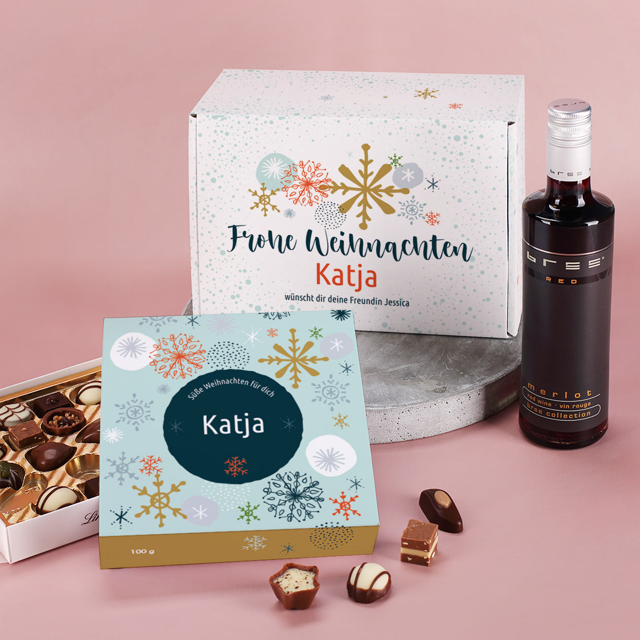 Geschenkset zu Weihnachten, Geschenkbox mit Lindt Pralinen und Wein