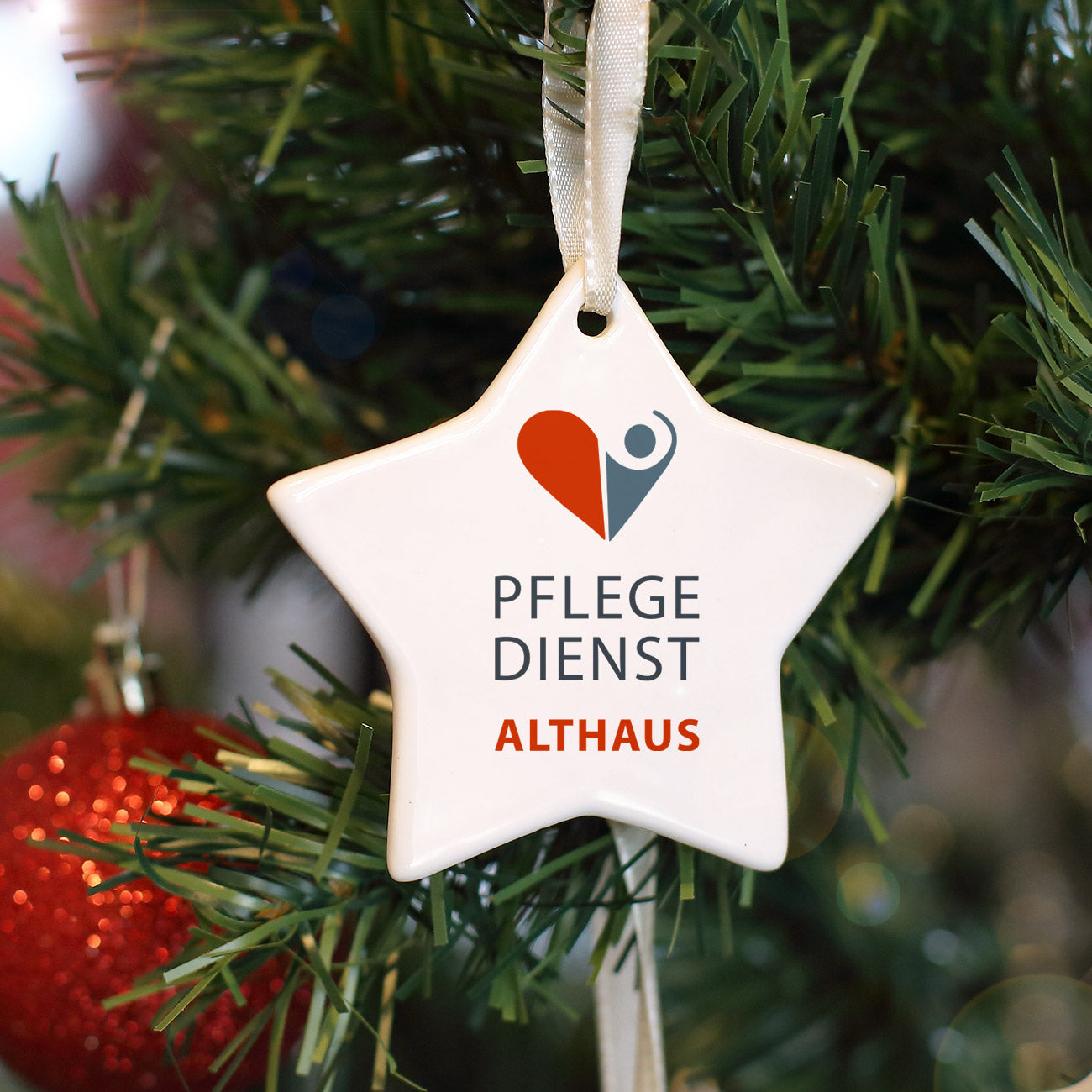 Anhänger für Christbaum in Sternform mit Firmenlogo