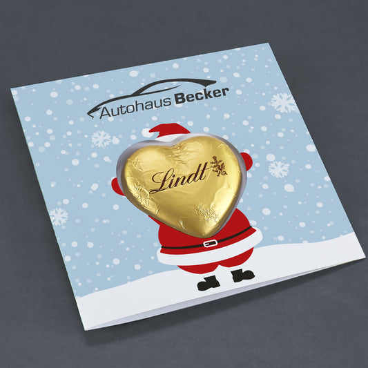 Geschäftliche Weihnachtskarte mit Weihnachtsmann und Lindt Schoko Herz