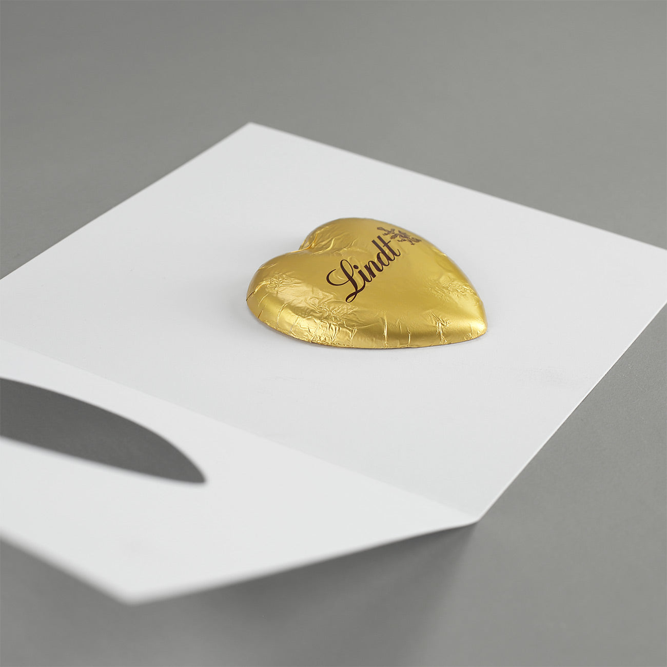 Klappkarte mit Lindt-Herz und Logo - Frohes Fest